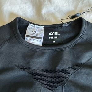 AYBL long sleeve active top charcoal, color with thumb holes new with tags